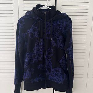 ATHLETA TRIUMPH HOODIE IN ASTRAL BLOOM BLACK SZ S